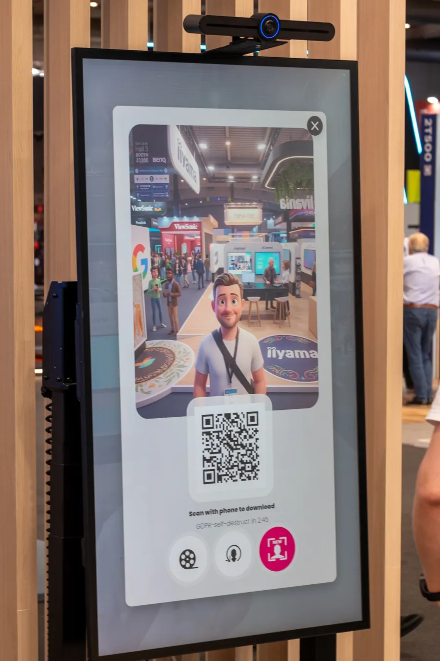 The result screen at ISE 2026: a visitor as a 3D cartoon in the exhibition hall, next to an iiyama stand with an iiyama rug.